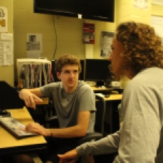 Filmmakers Carter Graf and Camryn Szynski are discussing the next steps in the editing process.